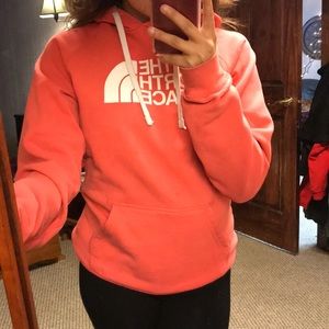 A pink north face hoodie